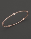 From the Rosé collection, a five-diamond hammered bangle. Designed by Ippolita.