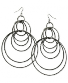 Style that runs circles around the competition. These orbital hoop earrings by GUESS are crafted in hematite tone mixed metal. Approximate drop: 4 inches. Approximate diameter: 3 inches.