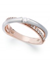 Sparkle and shine combine on this pretty overlap ring. Crafted in sterling silver and 14k rose gold with sparkling round-cut cubic zirconias (1/6 ct. t.w.). Size 7.