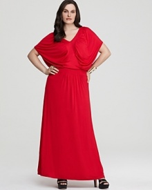 This Melissa Masse dress defines divine draping in a fluid maxi silhouette with a chic, defined waistband.