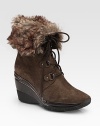 Rustic, weatherproof suede design with a substantial wedge, lace-up front and faux-fur cuff.Rubber wedge, 3 (75mm) Shaft, 6½ Leg circumference, 13 Faux-fur cuff Weatherproof suede upper Breathable microfiber lining Rubber sole Padded insole Imported