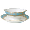 Inspired by the flamboyant designs of the 19th century, Eden Turquoise is both refined and sophisticated. This Limoges porcelain dinnerware service is a remarkable reproduction that captures the beauty of engraved gold work. Made in Limoges, France.