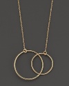 Two golden hoops punctuate a 14K gold chain.