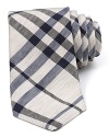 Burberry's classic check print gets a summer-style makeover in lightweight linen and silk. With navy and black tones against natural almond, this skinny tie goes best with timeless basics.