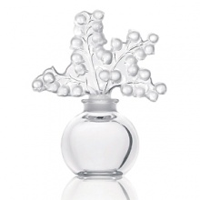 Originally designed in 1931 by Rene Lalique. this elegant perfume bottle is topped with a burst of lilies of the valley.