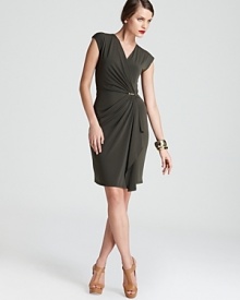 A soft, sophisticated MICHAEL Michael Kors faux-wrap dress has a chic crossover neckline that fastens with a signature golden clasp at the waist for flattering, feminine style.