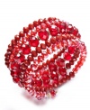 Code red. Add a bold burst of color to your look with c.A.K.e. by Ali Khan's chic crimson-hued coil bracelet. Featuring glass rondelle beading, it's made in mixed metal. Approximate diameter: 2-1/4 inches.