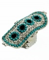 Let your hands do the talking in this striking conversation piece. GUESS's statement-making style features turquoise-colored plastic beads and sparkling crystals for extra shine. Set in silver tone mixed metal. Ring stretches to fit finger.