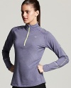 Made with Dri-FIT technology to wick away moisture, pull on this Nike top for travel to and from the gym or for a weekend outdoor run.