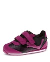 A sleek look and a flashing formstrip with LEDs that light up with each step brings extra fun to her athletic ensemble.