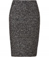 Channel the sultry librarian look in this super chic knit pencil skirt from Tara Jarmon - Fitted silhouette, multicolor textured knit, back slit, concealed back zip closure - Pair with a tie-neck blouse and heels