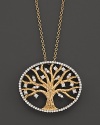 Diamonds, set in 14K yellow gold, bloom in and around a tree of life.