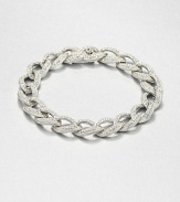 Tapered leaf-shaped links, encrusted with pavé crystals, form an elegantly simple chain bracelet with endless sparkle.CrystalRhodium platingLength, about 7¼Width, about ½Box-and-tongue claspImported