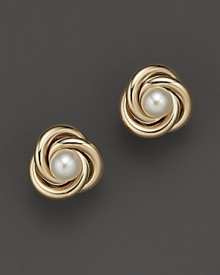 A gleaming cultured pearl rests in a nest of coiled 14K yellow gold.