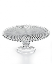 The Swirl cake stand steals the spotlight at casual tables with fluted detail, beaded trim and a look of antique grace. From Martha Stewart Collection.