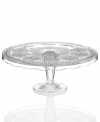 Past meets present. Feminine scalloped edges, raised medallions and fluted accents in sparkling glass make this Modern Vintage cake stand a standout at the table and on display. From the Godinger serveware collection.