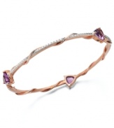 A slim row of sparkle makes a big impact. Victoria Townsend's pretty bangle bracelet slips over the wrist and shines in trilliant-cut amethyst (7-1/2 ct. t.w.) with diamond accents. Set in 18k gold over sterling silver. Approximate length: 8 inches. Approximate diameter: 2-1/2 inches.