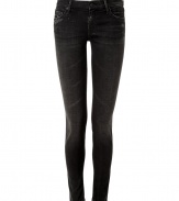 The ultimate edgy must-have, these luxe jeans from It denim brand Mother are the favorite skinnies of the fashion flock - Classic five-pocket styling, stylishly destroyed washed black denim, skinny leg - Form-fitting - Style with an oversized cashmere pullover, biker boots and a leather jacket