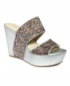 Stunning straps. Nine West's Larysa platform wedge sandals slide on comfortably and are super stylish too.