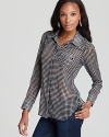 Whether fancied up with a pencil skirt or laid-back with jeans, this GUESS button-down top exudes effortless chic.