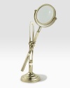 This fully functioning standing magnifier is crafted in a vintage-inspired silhouette from antiqued brass.11½ H, 4 diameterBrass and glassImported