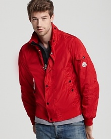 Trim and sporty, this handsome jacket protects your from the elements and introduces a bold pop of color into your cold-weather wardrobe.