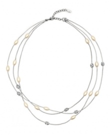 Create an optical illusion with this stylish three layer necklace by Monet. Each delicate strand features crystal coated beads and blanc glass pearls. Set in shining silvertone mixed metal. Approximate length: 16 inches + 2-inch extender.