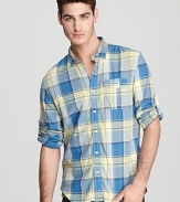 Effortless style in mellow plaid, this hip button-down shirt makes a great call for a weekend of lounging with friends.