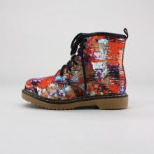 Trendy and tough, these girls'combat boots are a fashionable take on a classic design. They feature a lace-up front, side zip entry, graffiti print textile upper and gum rubber outsole. Imported.