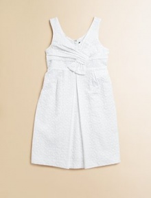 An angelic, eyelet frock with slight pleating in a crisp, clean hue is perfect for any special occasion.V-neckSleevelessHidden back zipperSlightly pleated skirtCottonMachine wash; dry flatImported