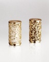 A handcrafted set of salt-and-pepper shakers makes a charming addition to the dinner table, each handcrafted in 14k goldplate with an intricate floral motif. From the Lorel Collection Set of 2 Each, 2½H X 1½ diam. Imported 