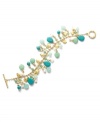 Let spring come early with the sweet blue and green hues of the Green Valley bracelet. Lauren by Ralph Lauren's serene style combines clusters of reconstituted turquoise, cultured freshwater pearls (4 mm) and gold accent discs. Setting and toggle clasp crafted in gold tone mixed metal. Approximate length: 7-1/2 inches.