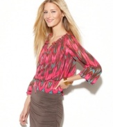 A tribal print gives INC's peplum peasant top a boho-glam look! Pair it with dramatic earrings for the finishing touch.