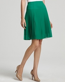 A Nanette Lepore skirt in a brilliant green hue flaunts trend-right color and feminine pleats, creating a lovely look to update your office repertoire for the new season.