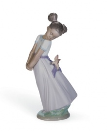 Pretty bird, pretty girl. A feathered friend helps tie her sash in a bow, creating a dreamy springtime scene in elegant Lladro porcelain.