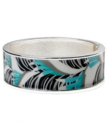 Channel the exoticism and energy of Brasil in Haskell's inspired skinny bangle. The Palm bangle features a blue and black palm leaf print design, set in silver tone mixed metal with a hinge clasp. Approximate diameter: 2-1/2 inches. Approximate length: 8 inches. Item comes packaged in a pink gift box.