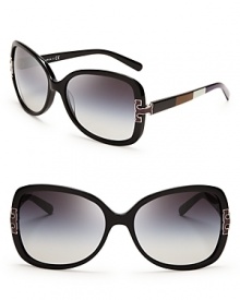 Steal the fashion show in these dark, oversized Tory Burch sunglasses, punched up with trendy colorblocked sides and bold logo accents.