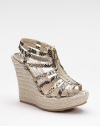 Ultra exotic, this strappy style in snake-printed metallic leather zips up the front and perches atop an espadrille platform wedge.Rope-covered wedge, 4¾ (120mm) Covered platform, 1½ (40mm) Compares to a 3¼ heel (80mm) Leather upper Front zipper Leather lining Padded insole Rubber sole Made in ItalyOUR FIT MODEL RECOMMENDS ordering true whole size; ½ sizes should order the next whole size up. 