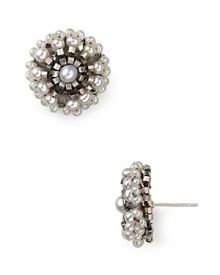 Geometric beading and natural shine illuminate these pretty studs from Miguel Ases, sure to add a simple shot of glamour to both silky dresses and crisp denim.