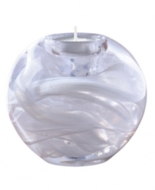 In lead crystal, this round votive holder mimics the mystery of the cosmos. Votive candle sits near the top. Measures 3-3/4.