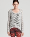 Bring texture to your fall looks with this luxe open-weave Helmut Lang sweater.