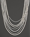 A lovely fresh water pearl necklace blending 7 strands of variously sized pearls.