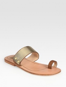 Lightweight metallic leather flat has hammered metal plating and a unique toe ring. Metallic leather upperLeather lining and soleImportedOUR FIT MODEL RECOMMENDS ordering one half size down as this style runs large. 