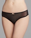 A charming mesh low-rise bikini with contrast trim and bow accent.