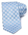 In silk satin, this gingham patterned tie lends a lighthearted, classic look.