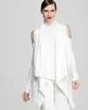 Add a layer of cool with this Donna Karan New York open shoulder cardigan. Worked over a staple white tank, the cut-out piece is both minimalist chic and downright fabulous.