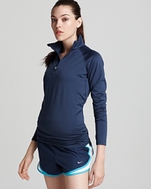 This cozy thermal Nike top features Therma-FIT fabric for keeping your core warm and Dri-FIT technology for superior moisture management.