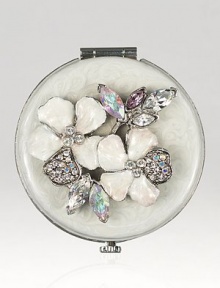 Jay Strongwater brings back old Hollywood glamour with this charming mirrored compact embellished with hand enameling and hand-set Swarovski crystals.Enamel and crystalSilvertoneHandmade, hand-enameled and hand-set2 diameterImported