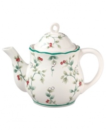 A classic holly print with raised detail and green banding makes the Pfaltzgraff Winterberry teapot a festive companion to the holiday table.