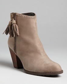 Prancing or dancing, step lively in this fun and feminine rendition of the Western booties trend from Stuart Weitzman.